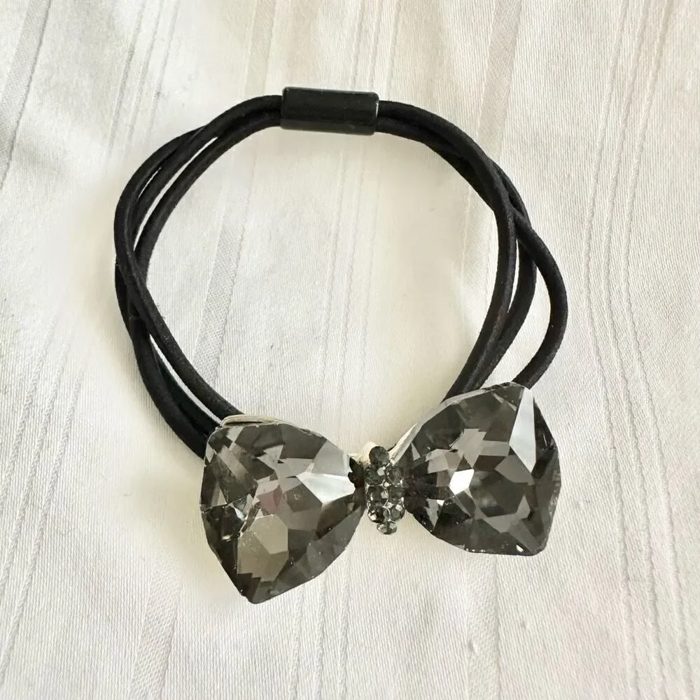 Chrome jeweled bow hair tie